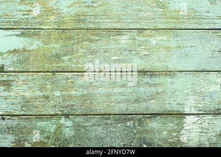 Wooden background with green colored horizontal planks and chipped paint Stock Photo