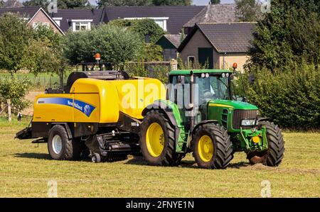 John Deere 6930 Tractor Baling Hay With Lely Welger Rp160 V Baler Stock Photo Alamy