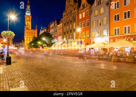 old town of Gdansk, night view on street cafe and walking people, photo made with long exposure Stock Photo