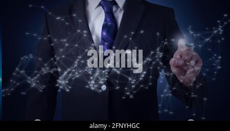 Network of connections against mid section of businessman touching invisible screen Stock Photo