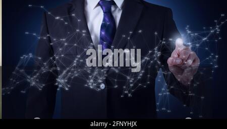 Network of connections against mid section of businessman touching invisible screen Stock Photo