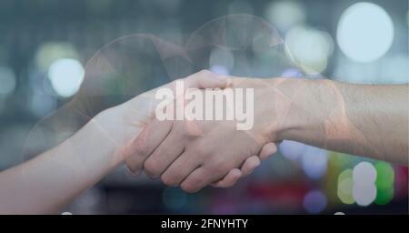 Cloud icon against mid section of two people shaking hands against spot of light Stock Photo