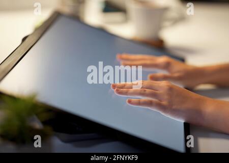 hands on led light tablet at night office Stock Photo