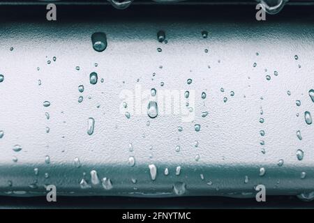 Raindrops and drip water on the shutter, detail Stock Photo