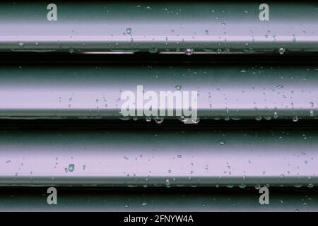 Raindrops and drip water on the shutter, detail Stock Photo