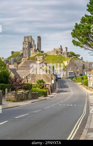 View of cottages on East Street and Corfe Castle, Corfe, Dorset, England, United Kingdom, Europe Stock Photo