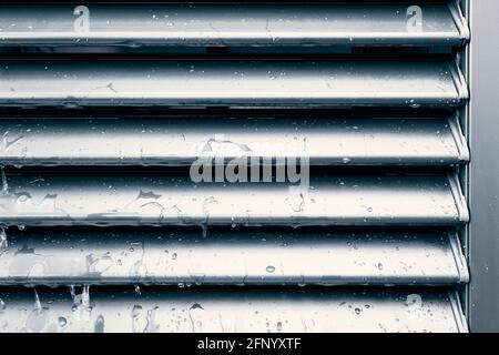 Raindrops and drip water on the shutter, detail Stock Photo