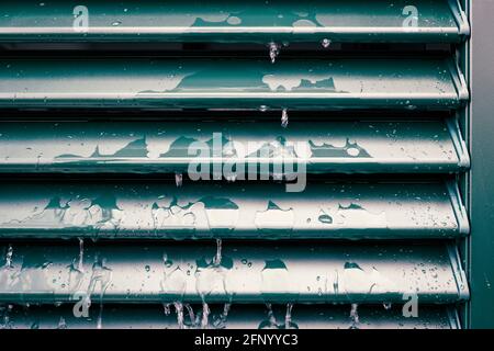 Raindrops and drip water on the shutter, detail Stock Photo