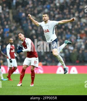 Eric Dier of Spurs beats Mesut Ozil of Arsenal to the ball during the Premier League match between Tottenham Hotspur and Arsenal at Wembley Stadium in London. 10 Feb 2018 -  Editorial use only. No merchandising. For Football images FA and Premier League restrictions apply inc. no internet/mobile usage without FAPL license - for details contact Football Dataco Stock Photo