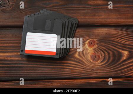 Diskettes on wooden background Stock Photo
