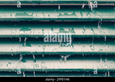 Raindrops and drip water on the shutter, detail Stock Photo