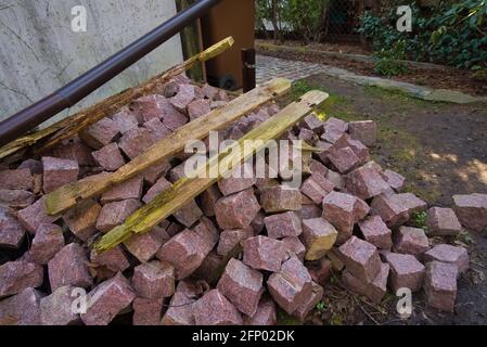 A stack of red, granite paving stones in the garden Stock Photo