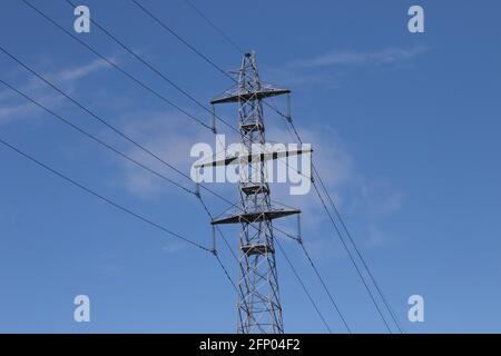 Erskine, Dumbartonshire. Scotland. UK Large electricity pylons by the River Clyde. Landscape format Stock Photo