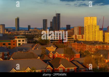 View of Manchester skyline and rooftops at sunset from Salford Quays, Manchester, England, United Kingdom, Europe Stock Photo