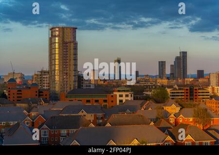 View of Manchester skyline and rooftops at sunset from Salford Quays, Manchester, England, United Kingdom, Europe Stock Photo