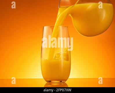 pitcher and a glass of orange juice Stock Photo - Alamy