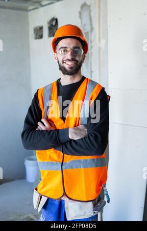 Young handsome worker smiling and looking at the camera Stock Photo