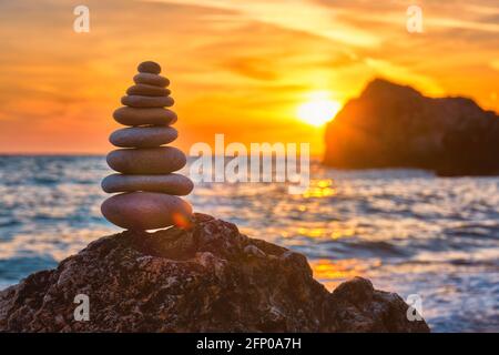 Concept of balance and harmony - stone stack on the beach Stock Photo