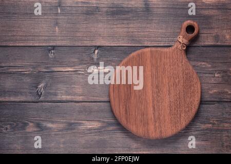 cutting board on a wooden table, top view Stock Photo