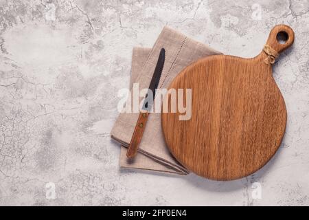 cutting board on a concrete table, top view Stock Photo