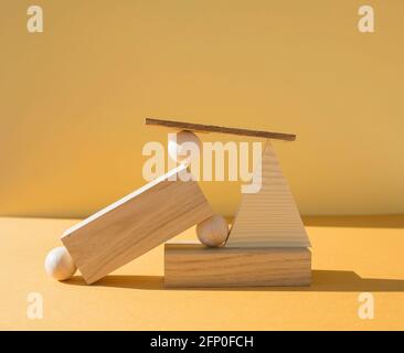 Geometric composition of several wooden figures. Stock Photo