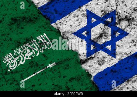 Concept of a Relationship between Saudi Arabia and Israel with painted flags on a rough wall with a crack Stock Photo