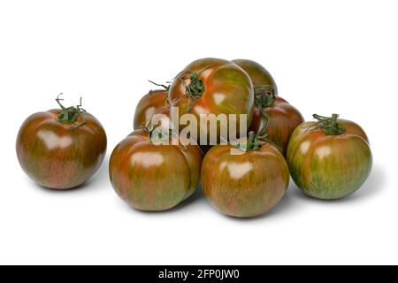 Group of ripe red and green striped whole fresh tomatoes close up isolated on white background Stock Photo