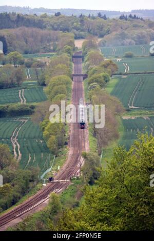 Dorking, Surrey, England, UK. 20th May, 2012. The Flying Scotsman locomotive steams through the leafy Surrey Hills near Dorking. The first outing of 2021 for this world famous steam train taking passengers on a round trip from London and into Surrey and back on a three hour journey on the Steam Dreams tour. Credit: Julia Gavin/Alamy Live News Stock Photo