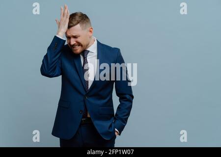 Stressed businessman feeling apset of business failure Stock Photo