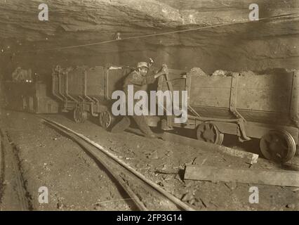 Child Labour: A brake boy on a wagon train ina West Virginia Coal mine. Photo 1908 Stock Photo