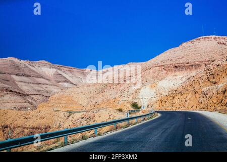 The ancient trade route known as the King's Highway between Aqaba and Petra in Jordan. Stock Photo