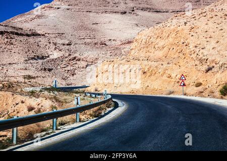 The ancient trade route known as the King's Highway between Aqaba and Petra in Jordan. Stock Photo