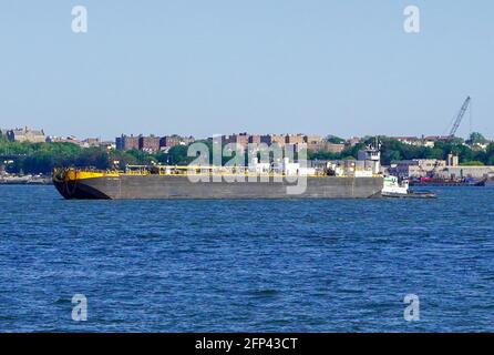 Oil Barges and Oil Tankers as seen in the Hudson River adjacent to New York City and New Jersey and arial views of oil storage tanks and the Linden New Jersey Oil Refinery. Photo by Jennifer Graylock-Graylock.com 917-519-7666 Stock Photo