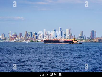 Oil Barges and Oil Tankers as seen in the Hudson River adjacent to New York City and New Jersey and arial views of oil storage tanks and the Linden New Jersey Oil Refinery. Photo by Jennifer Graylock-Graylock.com 917-519-7666 Stock Photo