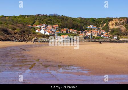 Runswick Bay is one of the Yorkshire Coast’s prettiest destinations with its sweeping, sheltered bay and charming red roof cottages. Stock Photo