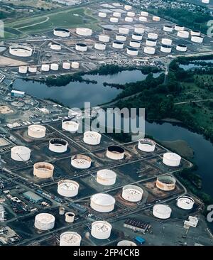 Oil Barges and Oil Tankers as seen in the Hudson River adjacent to New York City and New Jersey and arial views of oil storage tanks and the Linden New Jersey Oil Refinery. Photo by Jennifer Graylock-Graylock.com 917-519-7666 Stock Photo