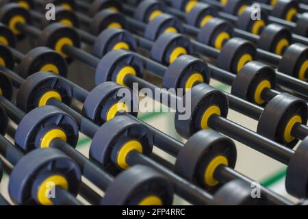 Conveyor line for the production consisting of small rollers close-up. Stock Photo