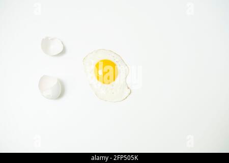 scrambled eggs with whole yolk and broken shells Stock Photo