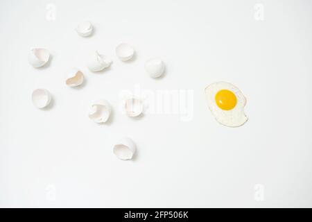 scrambled eggs with whole yolk and broken shells Stock Photo