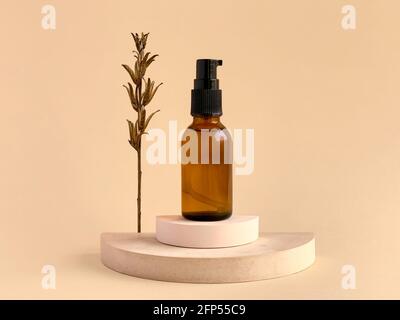 Amber glass bottle for skin cosmetic or gel sanitizer, natural concept Stock Photo