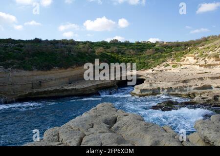 MARSAXLOKK, MALTA - 03 JAN, 2020: Beautiful view over St. Peter Pool in winter with churned up Mediterranean Sea Stock Photo