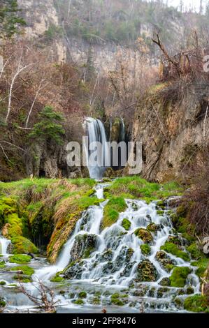 Long exposure of flowing water over a waterfall in South Dakota Stock Photo