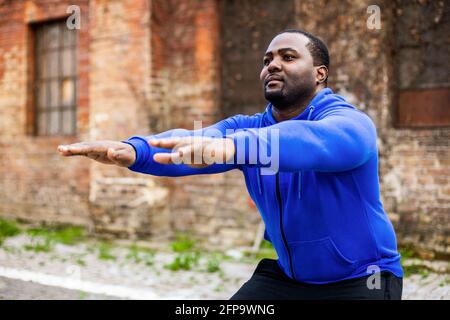 Sporty man enjoys  exercising outdoor. Stock Photo