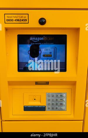 Woodbridge, Suffolk, UK April 24 2021: An Amazon locker outside a rural countryside shop in the UK, customers can collect parcels at their convenience Stock Photo