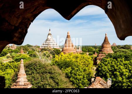 View from Law Ka Ou Shaung temple in Bagan, Myanmar. Shwesandaw pagoda on the left. Stock Photo