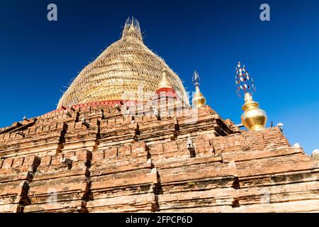 Dhammayazika Pagoda in Bagan, Myanmar. Pagoda is under a scaffolding because of repairs after the earthquake of 2016. Stock Photo