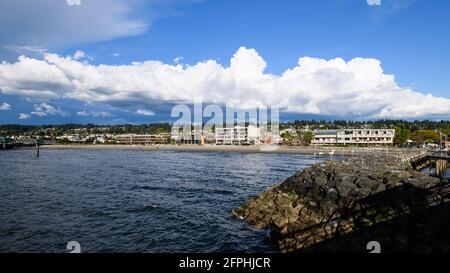 Clouds hang over Snohomish County in Washington State and behind the Edmonds waterfront Stock Photo