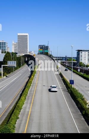 Tacoma, WA, USA - May 16, 2021; Single car exits from Interstate 705 in Tacoma to Pacific Avenue.  This is a short freeway connecting to Interstate 5