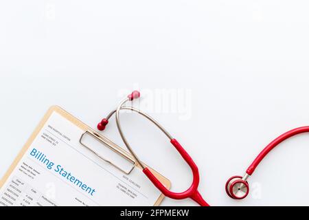 Stethoscope with medical billing statement. Top view Stock Photo