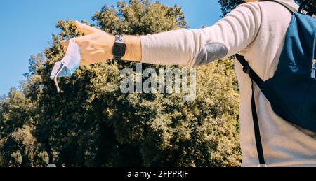 Quarantine is over concept. man taking off mask against. Healthy active concept. End of quarantine Coronavirus ended.  Stock Photo